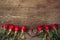 Close up on roses over wooden table with ribbon heart