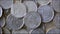 Close-up of Rotating Golden Euro Coins, Blurry Background