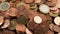 Close-up of rotating metal coins. Rotating pile of euro cents.