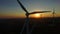 Close up of rotating windmill blades at sunset