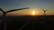 Close up of rotating windmill blades at sunset