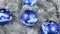 Close-up of a rotation of blue Christmas balls. Christmas background, tinsel.