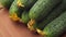 Close-up. Rotation of natural ripe green cucumbers . Food background. ProRes 422 4K