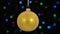 Close-up, the rotation of a yellow Christmas ball hanged on a golden rope. Christmas and New Year decoration.