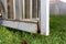 Close-up of rotten wood on exterior screen door