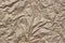 Close-up Of Rough Brown Wrinkled Packaging Paper Texture Backgro