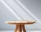 Close up of a round empty teak wood table with sunlight.background for products overlay. Mock up