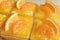 Close-up of Rowed up Mandarin Orange Cakes in Glass Bowls Topped with Fresh Oranges