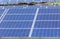 Close up rows array of polycrystalline silicon solar cells or photovoltaic cells in solar power plant station