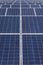 Close up rows array of polycrystalline silicon solar cells or photovoltaics in solar power plant turn up skyward