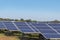 Close up rows array of polycrystalline silicon solar cells or photovoltaics in solar power plant turn up skyward absorb the sunlig