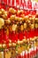 Close up rows Devotees hanging golden prayer bells for blessing at at Wong Tai Sin Temple, Hong Kong