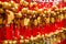 Close up rows Devotees hanging golden prayer bells for blessing at at Wong Tai Sin Temple, Hong Kong