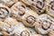 Close-up of rows of frosted cinnamon buns