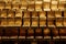 close-up of rows of gleaming ingot bars of gold