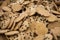 Close up of rows of oatmeal raisin cookies sitting on wax paper on table top