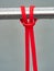 Close-up of a rubber elastic band training knot hanging on a workout crossbar