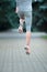 Close up of runners in training. Sport shoes on road. Rear view.