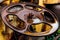 Close up of rust wheel on yellow freight train car.