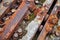 close-up of rusted iron bolts and joints from an old ruined bridge