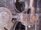 Close up of rusted iron connecting rods and gears with bolts on old corroded machinery