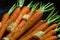 Close up of rustic carrotts in a pan with butter on wood