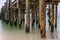 Close up of rustic wooden jetty in the sea