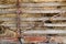 Close up of rusty old flatbed trailer stacked up with hay.