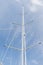 Close up of sailboat mast over blue sky