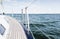 Close up of sailboat or sailing yacht deck and sea