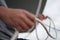 Close up of a sailors hand coiling up a rope, sheet on a sailboat