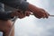 Close up of a sailors hand pulling a rope, sheet on a sailboat