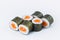 Close-up of Sake Maki Roll with salmon and rice wrapped in nori seaweed isolated on gray background