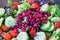 Close-up of a salad with promegranate, cucumber, lettuce and cherry tomatoes.