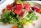Close-up of salad with raw tuna fish, avocado and sesame seeds