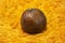 Close-Up of Salak Fruit or Snake Fruit on an Orange Background. It is considered to be Crispy like An Apple