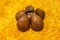 Close-Up of Salak Fruit or Snake Fruit on an Orange Background. It is considered to be Crispy like An Apple