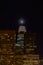 Close up of Salesforce tower san francisco with moon, night time