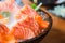 Close-up salmon raw sashimi on brown Japanese traditional dish o