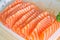 Close up of salmon sashimi in a plastic box