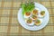 Close up salted egg salad , mix many vegetable ,Mix boiled egg ,Thai food in white dish on bamboo weave background