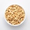 Close up of Salted Peanuts Indian namkeen snacks on a ceramic white bowl.