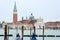 Close up of San Giorgio Maggiore church with ships transporting people around it