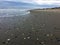 Close up of the sand with seashells and the ocean