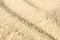 Close-up sand texture background with selective focus. Summer beach surface. Sandy nature