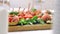 Close up sandwich canapes on the buffet table. Red tomatoes with mozzarella cheese with herbs and sausage with bread