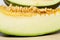 Close-up of Santa Claus melon slice with seeds