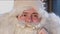 Close up of Santa\'s surprised face. December evening before Christmas New Year