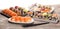 Close up of sashimi sushi set with chopsticks and soy - sushi roll with salmon and sushi roll with smoked eel