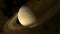Close up Saturn on night sky and light orange cloud moving pass